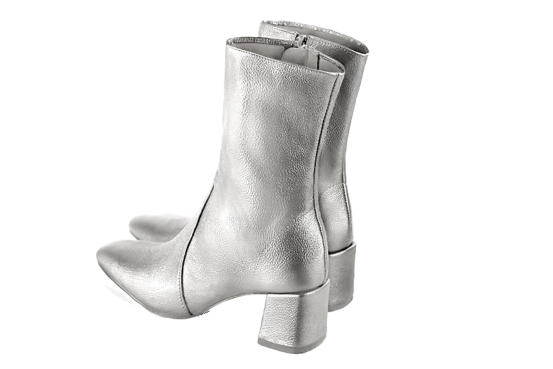 Light silver women's ankle boots with a zip on the inside. Square toe. Medium block heels. Rear view - Florence KOOIJMAN